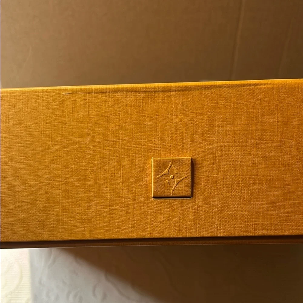 Louis Vuitton Signature  Box inside a LV shipping box with tissue and ribbon.